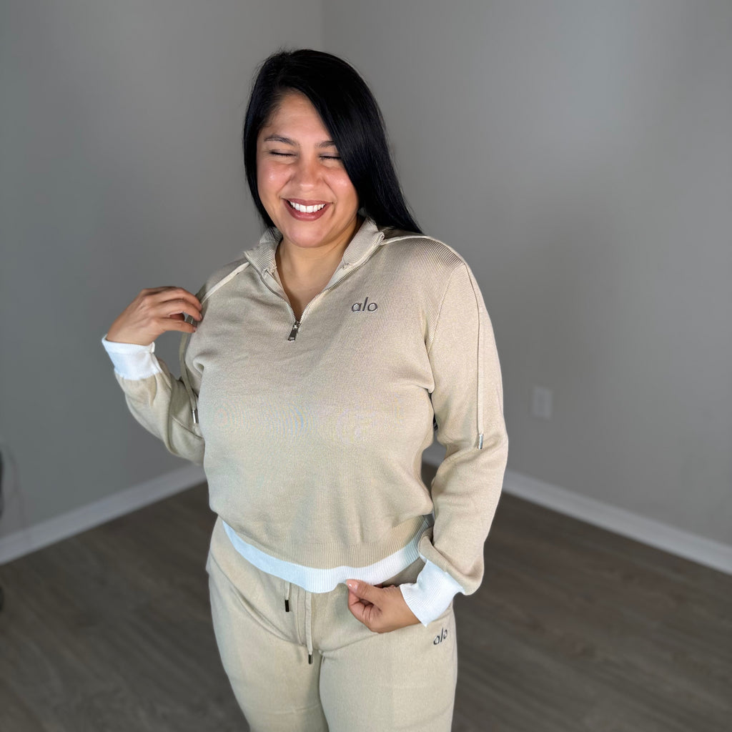 Cream two-piece set with shiny brown details.