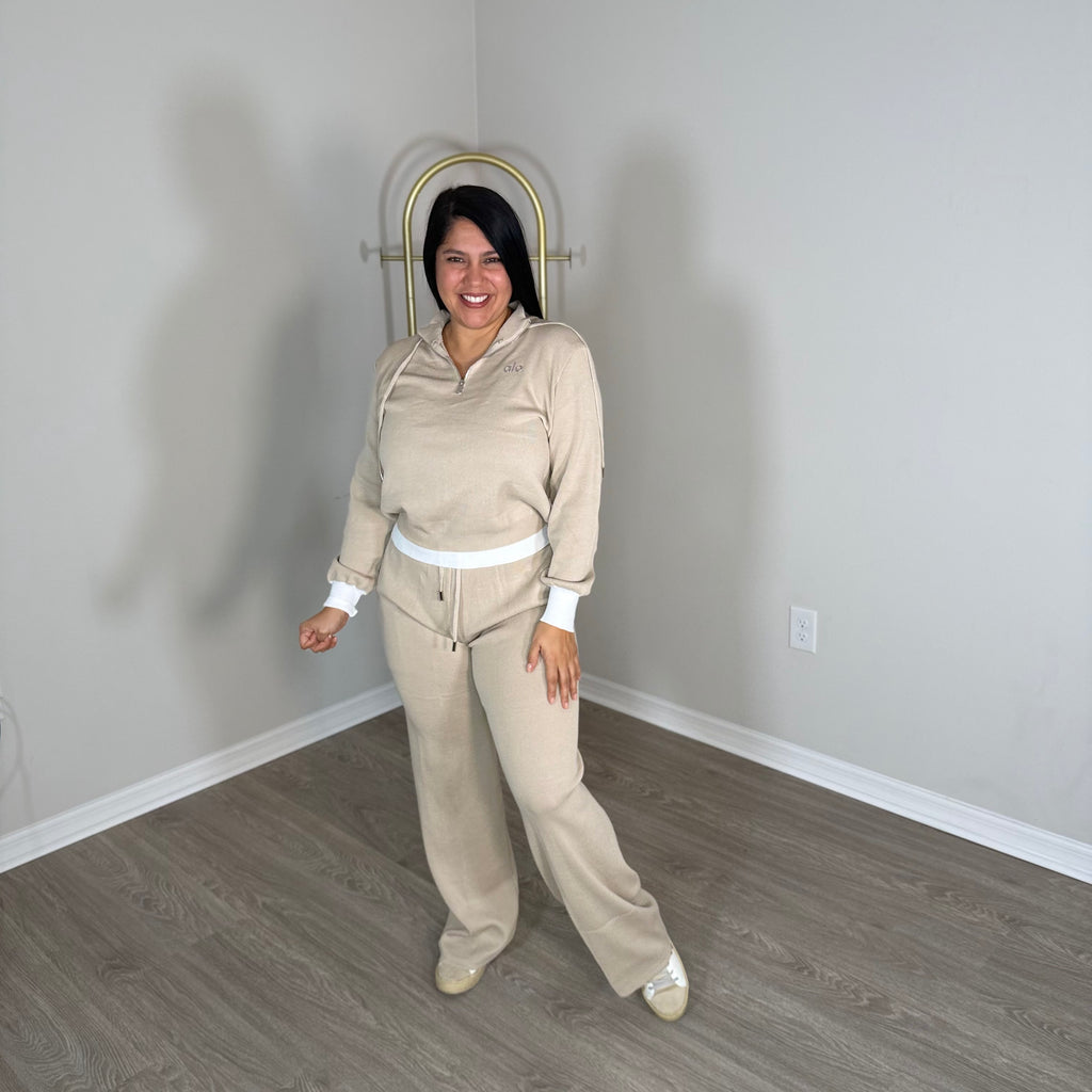 Cream two-piece set with shiny brown details.